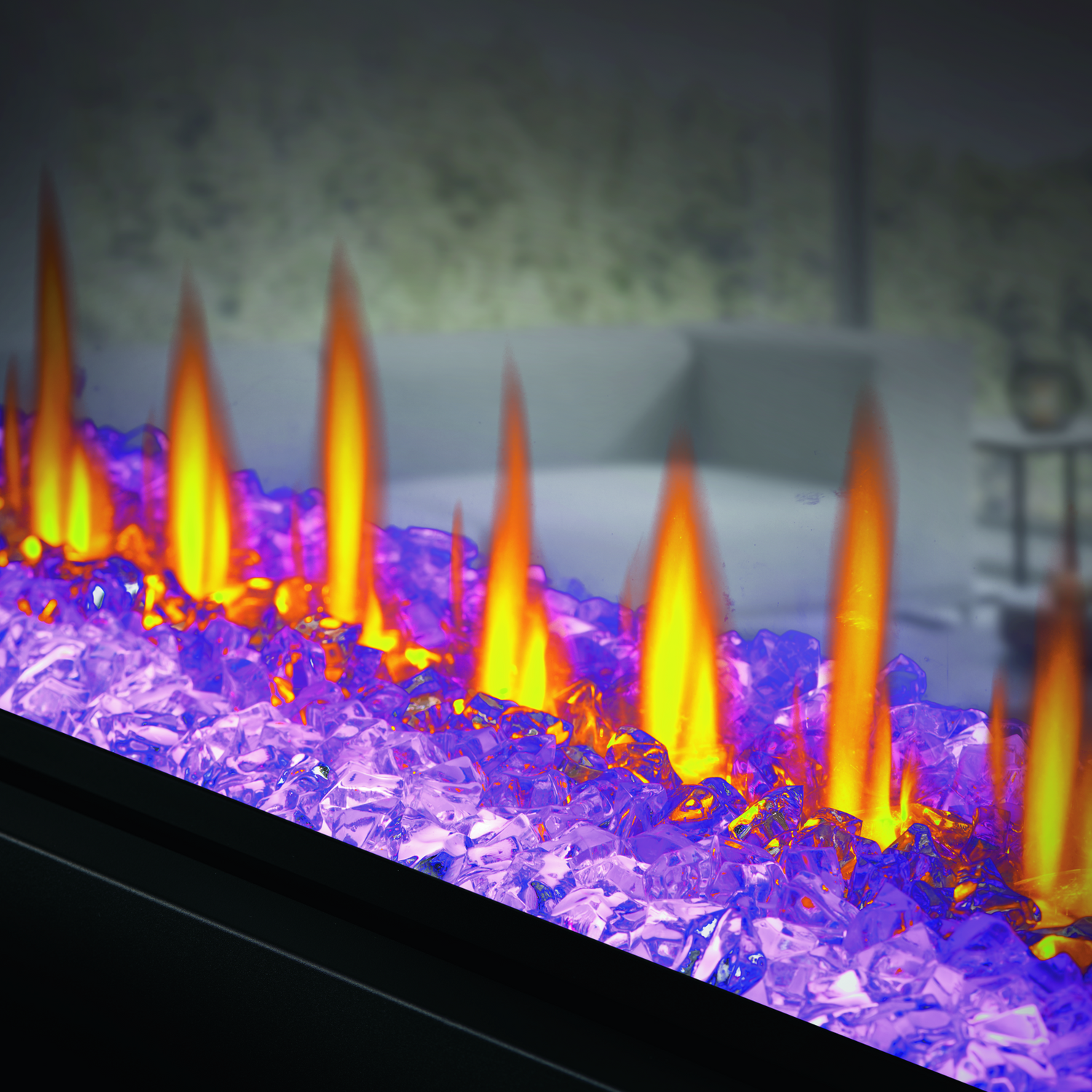 Electric fireplace with colorful flames and glowing embers in a room setting.