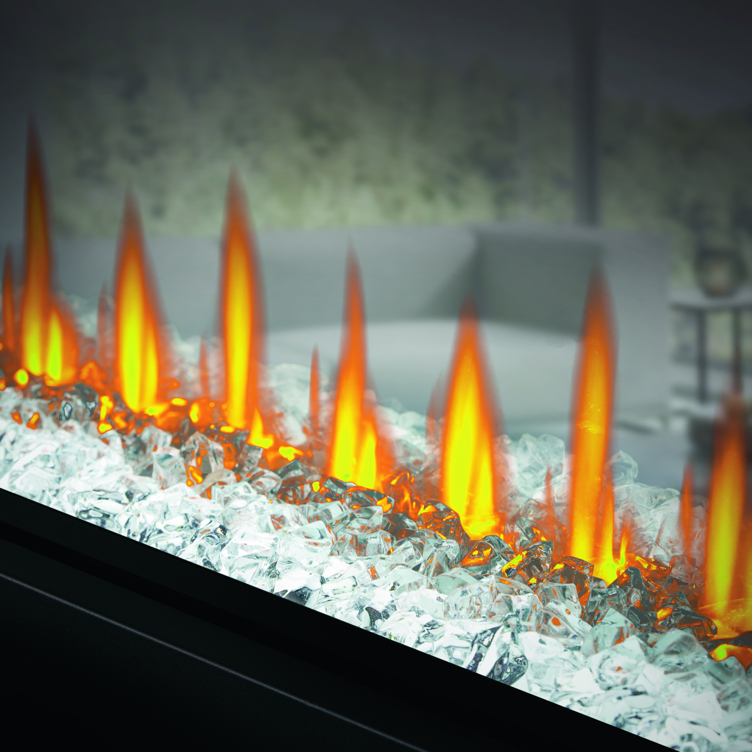 Modern electric fireplace with glowing flames and glass beads in a living room setting.