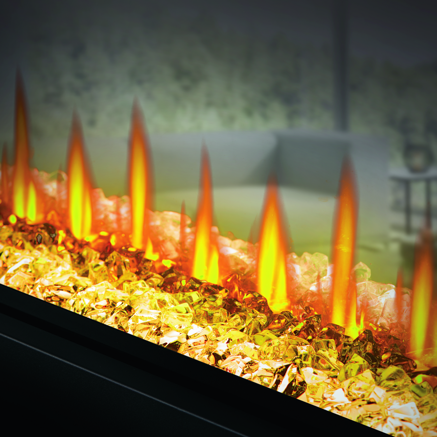 Close-up of a fire pit with glowing embers and flames.