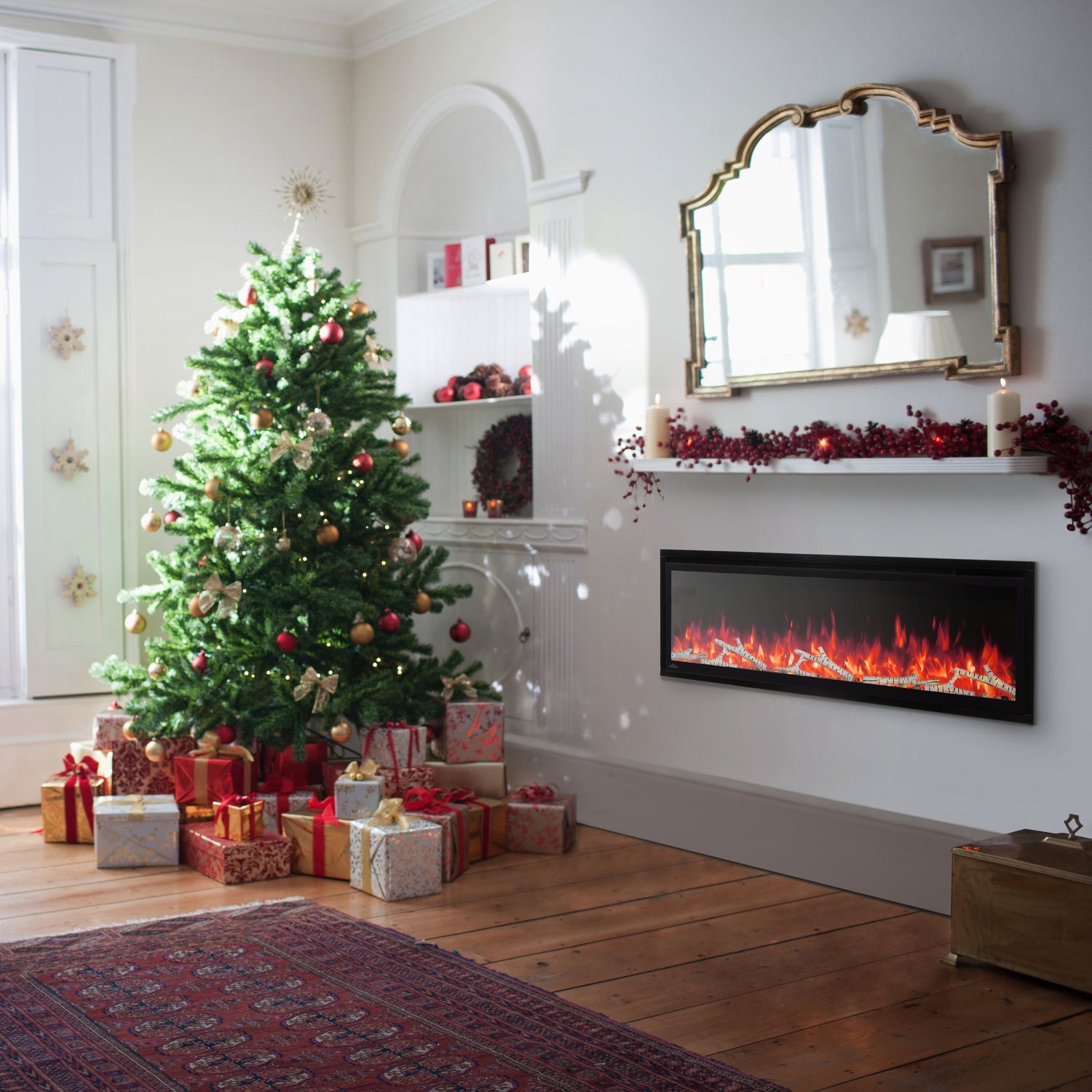 Living room with Christmas tree, presents, and a fireplace.
